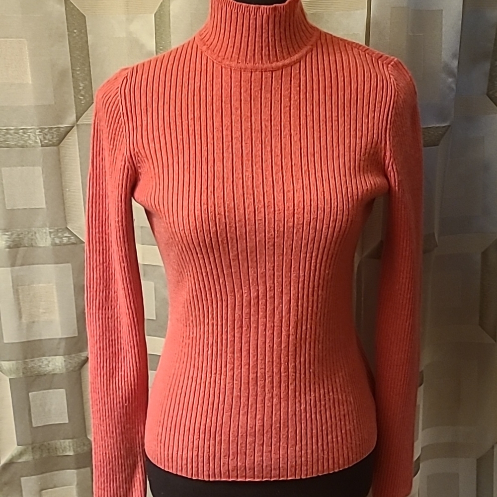 Coral Ribbed Cashmere Turtleneck Sweater.